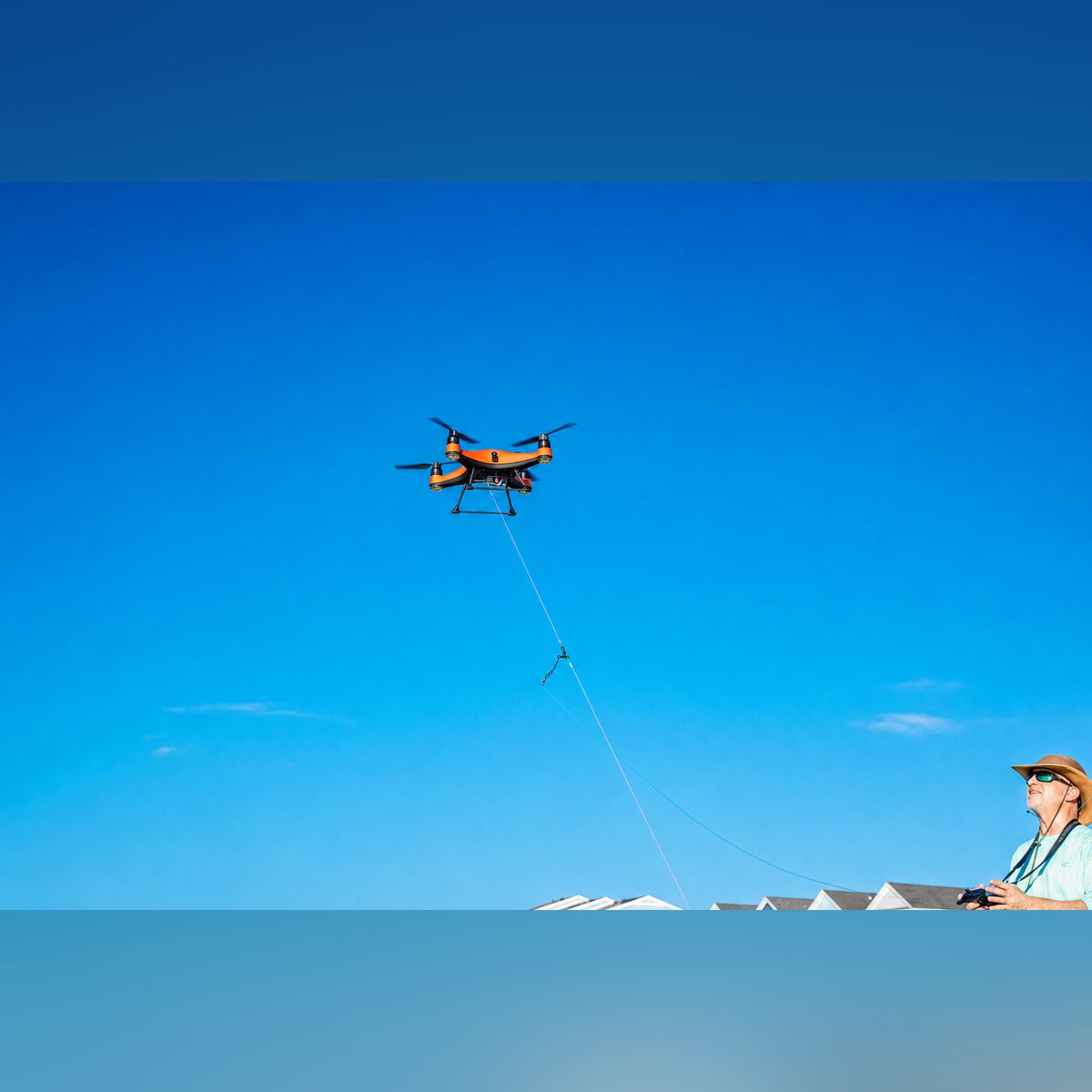SwellPro Fisherman FD1+ dropping bait mid-flight