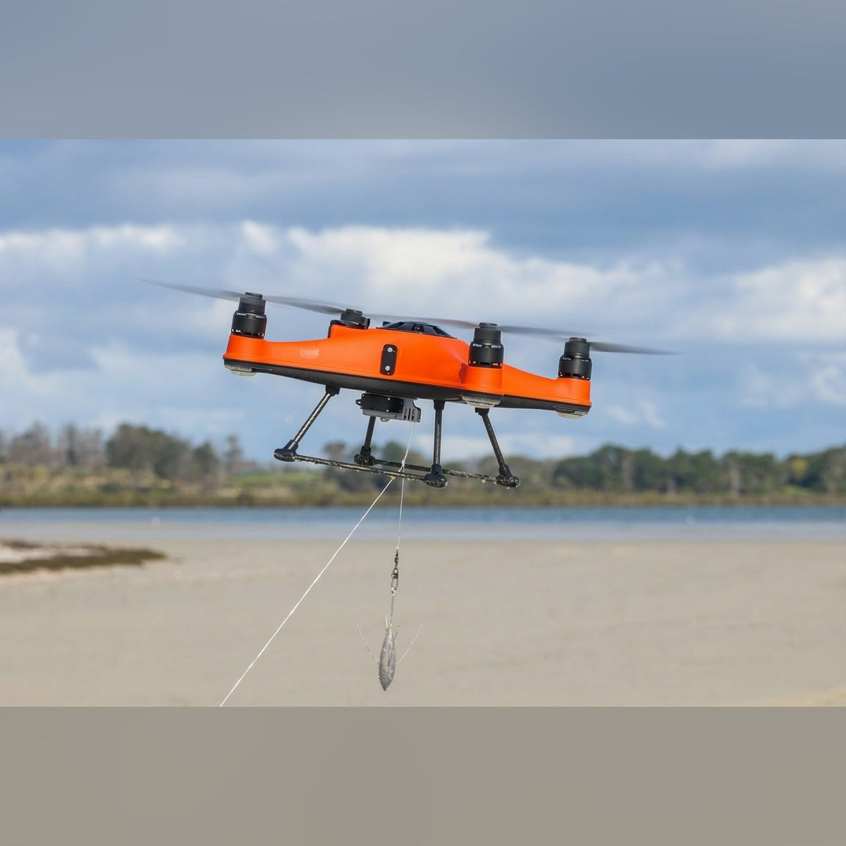 SwellPro Fisherman FD1+ in flight over water in New Zealand