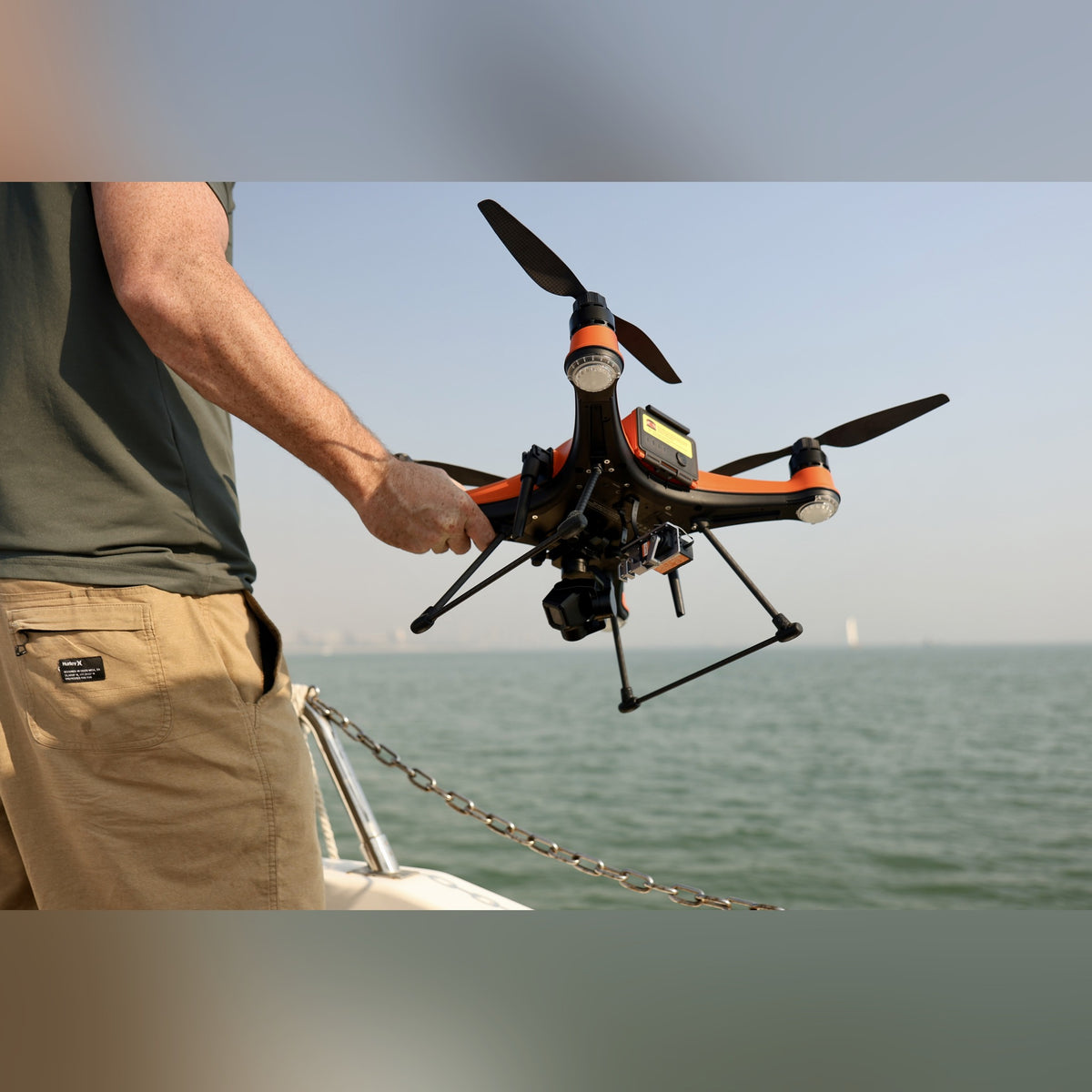 SwellPro SplashDrone 4+ hand-held aboard a boat